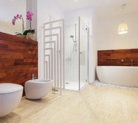 Bright stylish bathroom with pink orchid